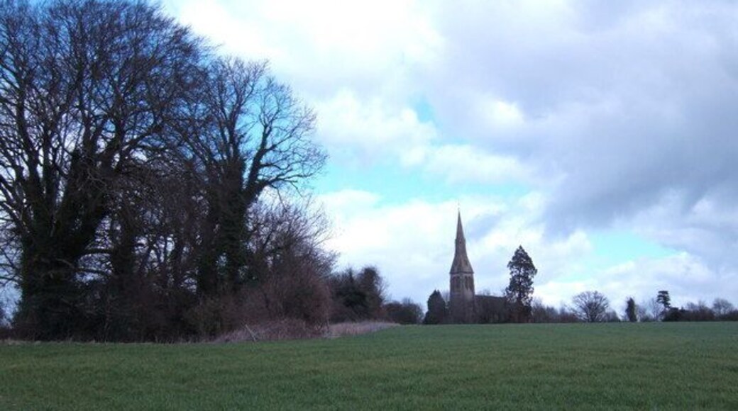 Holy Trinity, Privett The tower and spire of Privett church form a prominent and unexpected landmark, in a deeply rural part of the Hampshire countryside which has changed little since Gilbert White wrote about it in the 18th century. A magnificent edifice, it was designed by Blomfield and built at the expense of Sir William Nicholson, the distiller, in 187678. Seen here from across the fields from the south.