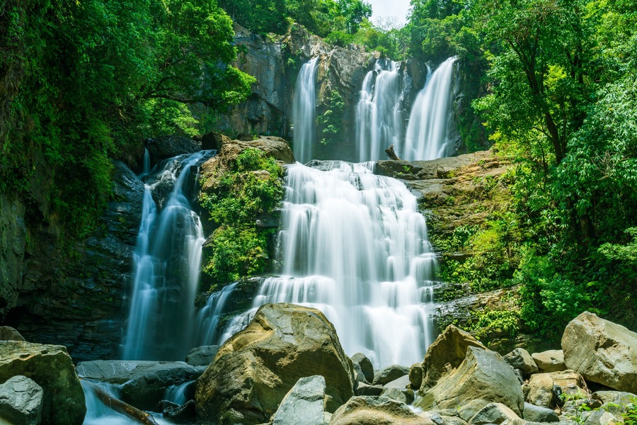 The tapering Nauyaca Waterfalls in Costa rica, a majestic cascading fall in Dominical province, Costa Rica