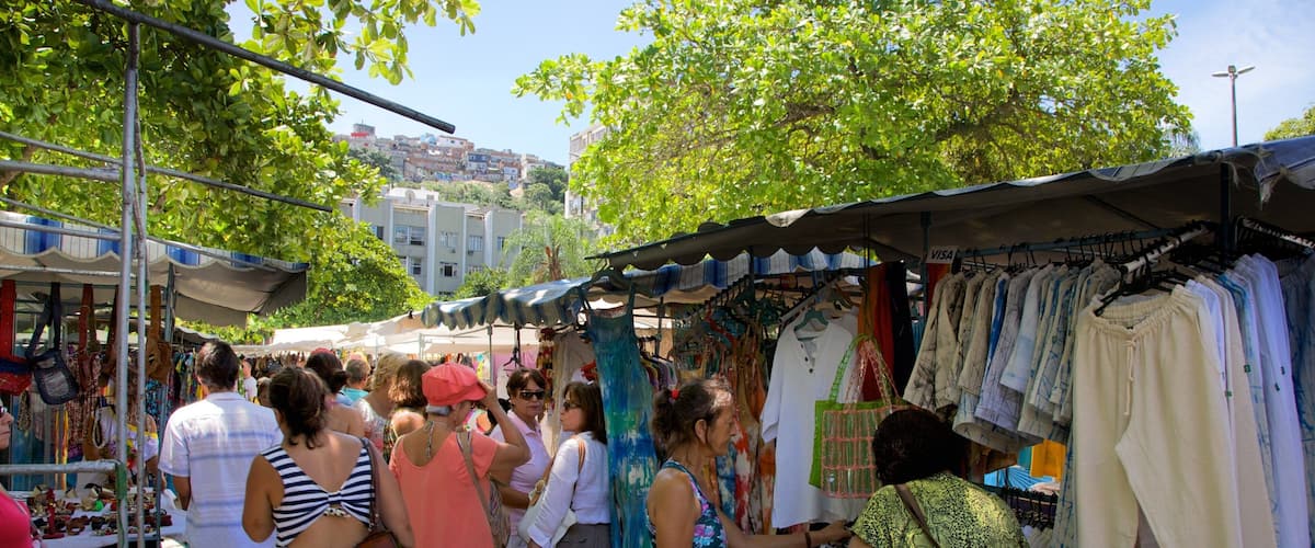 Ipanema showing markets as well as a large group of people