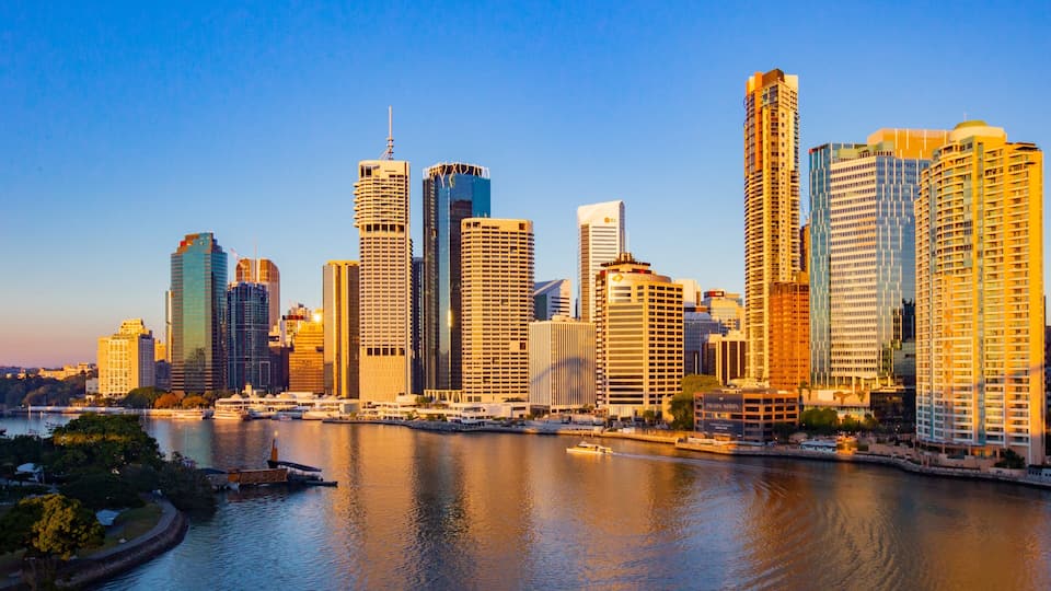 Brisbane Central Business District which includes a river or creek, a sunset and a city