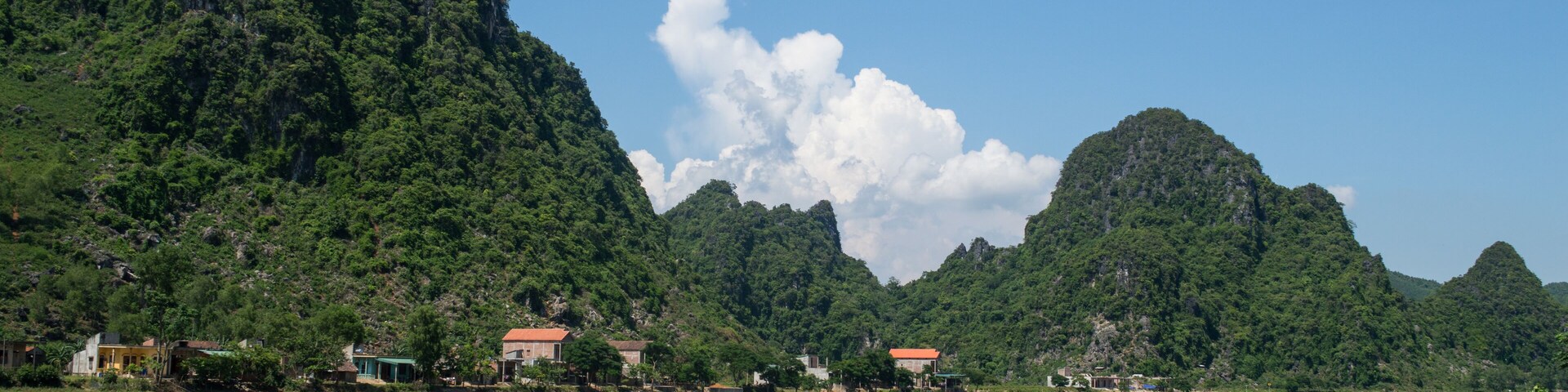 Limestone Landscape with River, Boat and Village, Dong Hoi, Vietnam