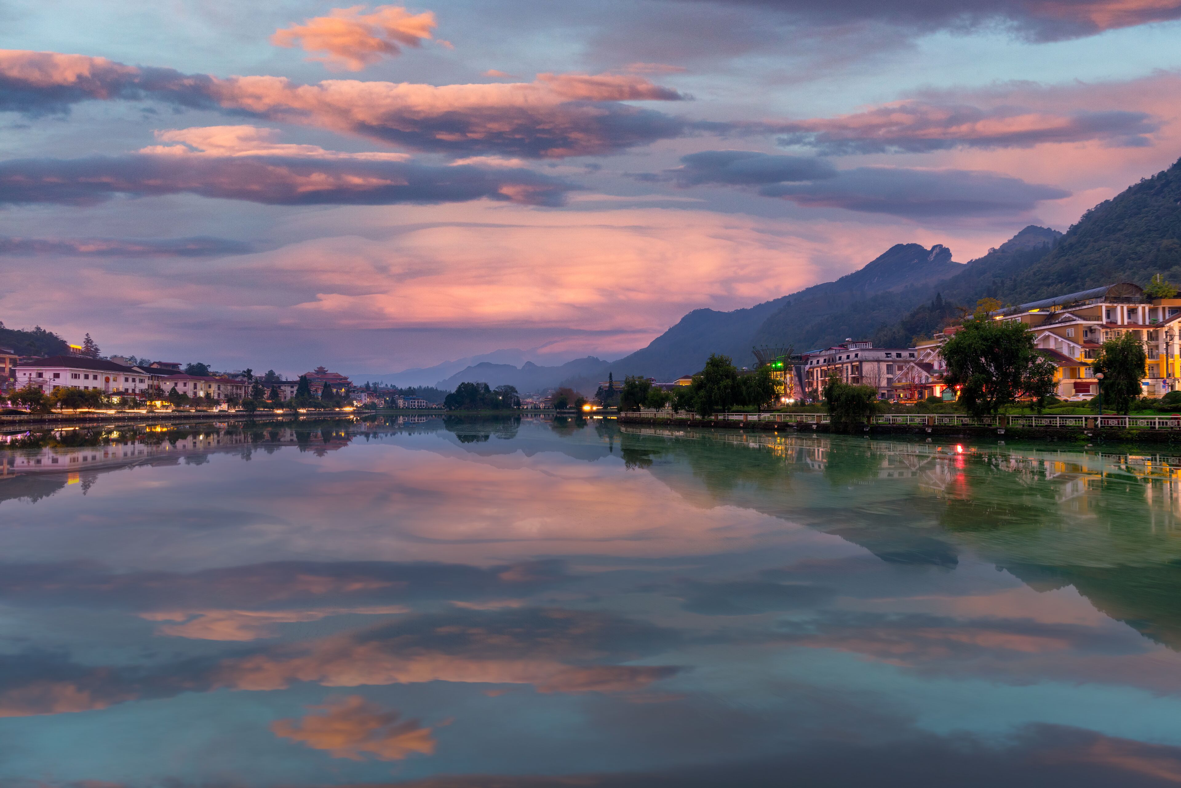 Sapa city reflects down on Sapa lake. Sa Pa is a tourist destination about more than 30 km from the center of Lao Cai city.