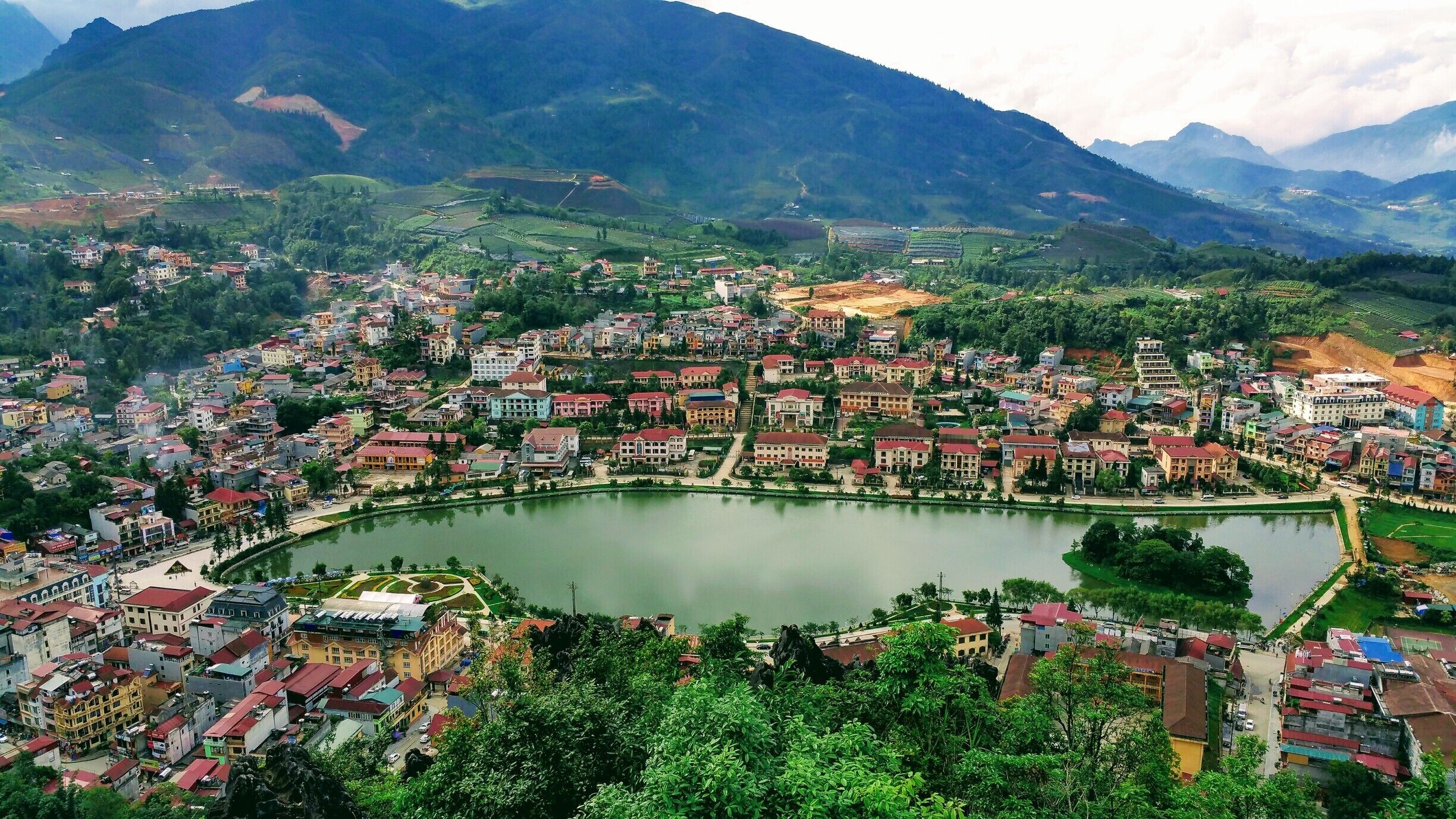 Sapa, Vietnam 

The View down on Sapa Lake. A very nice walk through scenic gardens and trail behind Sapa Church, leading to a nice view of the town.  #packsandaplan 