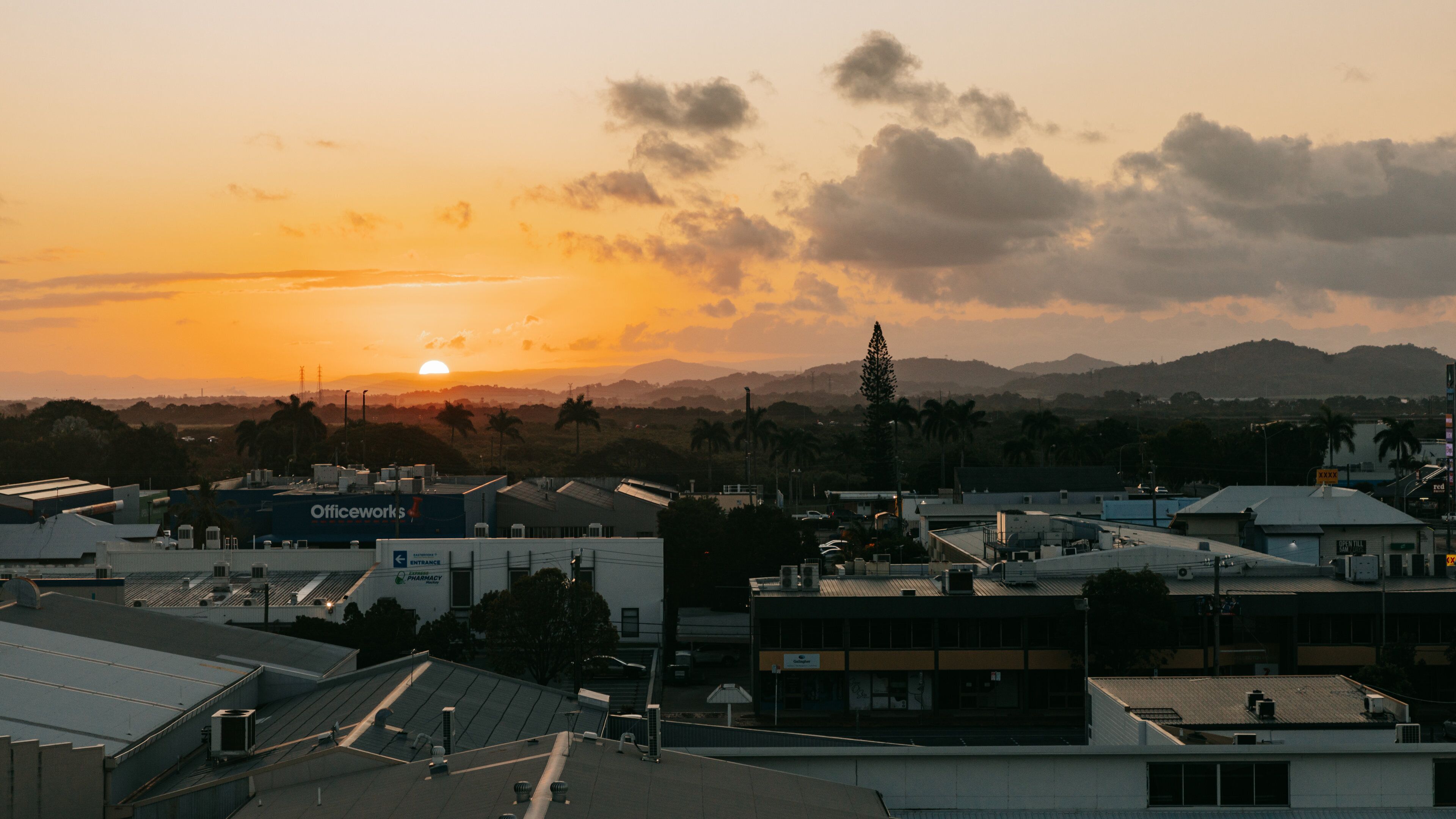 Mackay featuring a small town or village, a sunset and landscape views