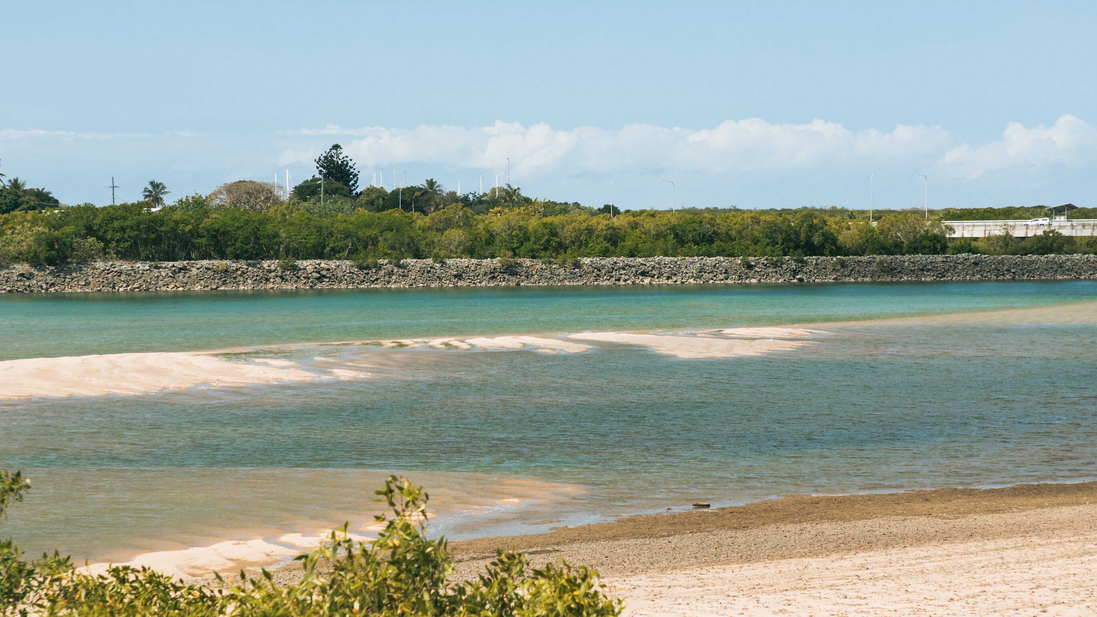 Mackay showing a beach and general coastal views