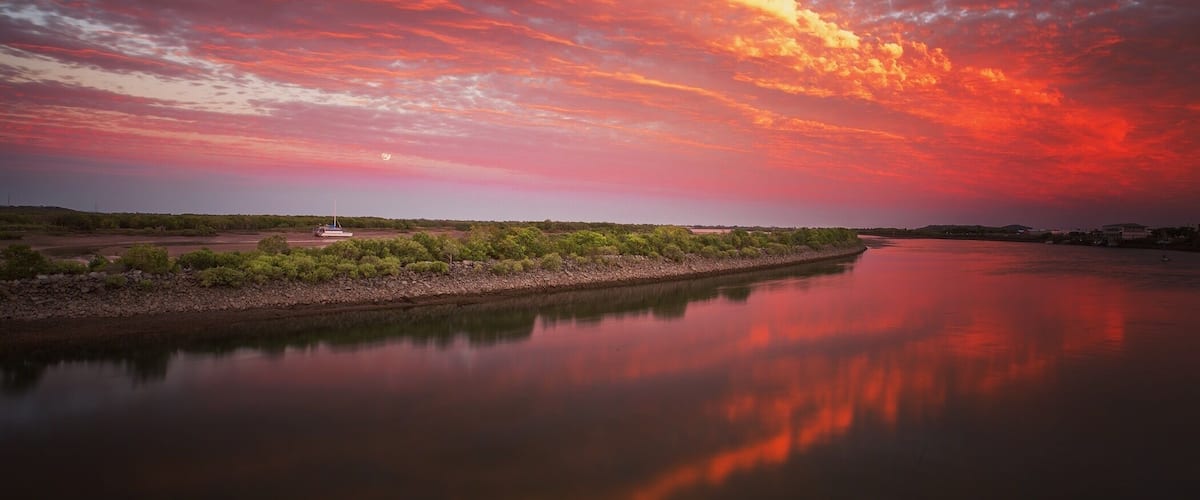 Sunset over the Pioneer River along the bike path.
