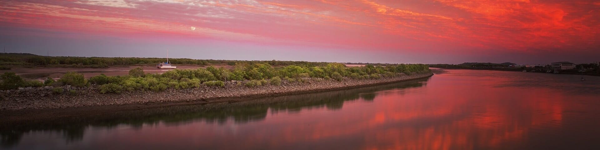 Sunset over the Pioneer River along the bike path.