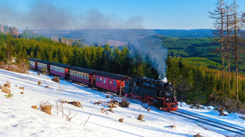 Steam train during winter in the snow in the Harz national park Germany,train Brocken Bahn on the way through the winter landscape, Brocken, Harz Germany