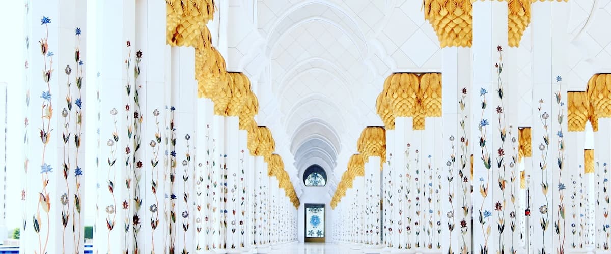 Walking around this glorious monument usually makes one wonder, ‘Is it for real?’ The Mosque is surrounded by large walkways which are aptly supported by marble-clad columns/pillars topped by gilded fronds. Each of these columns have beautiful floral designs, inlaid with semi-precious stones like amethyst, mother of pearl, red agate and a few more. The marble flooring gives a splendid reflection of these columns. When in Abu Dhabi, one must visit the Sheikh Zayed Grand Mosque and admire the sheer talent and hard-work that went behind in creating it.