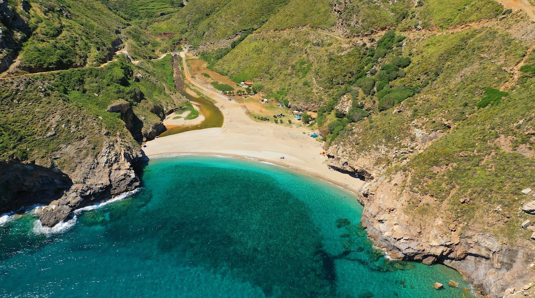 Aerial drone photo of secluded sandy emerald beach and canyon of Agios Dimitrios near Karistos, South Evia island, Greece