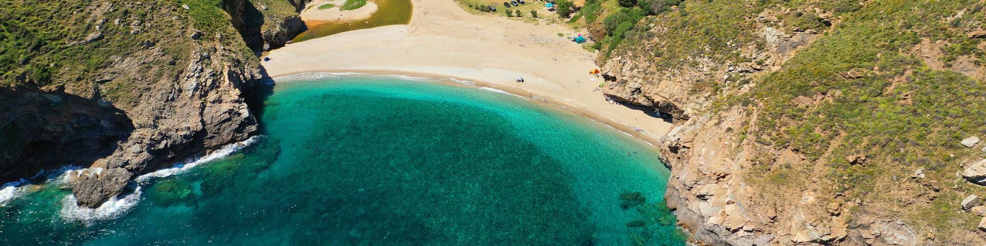 Aerial drone photo of secluded sandy emerald beach and canyon of Agios Dimitrios near Karistos, South Evia island, Greece