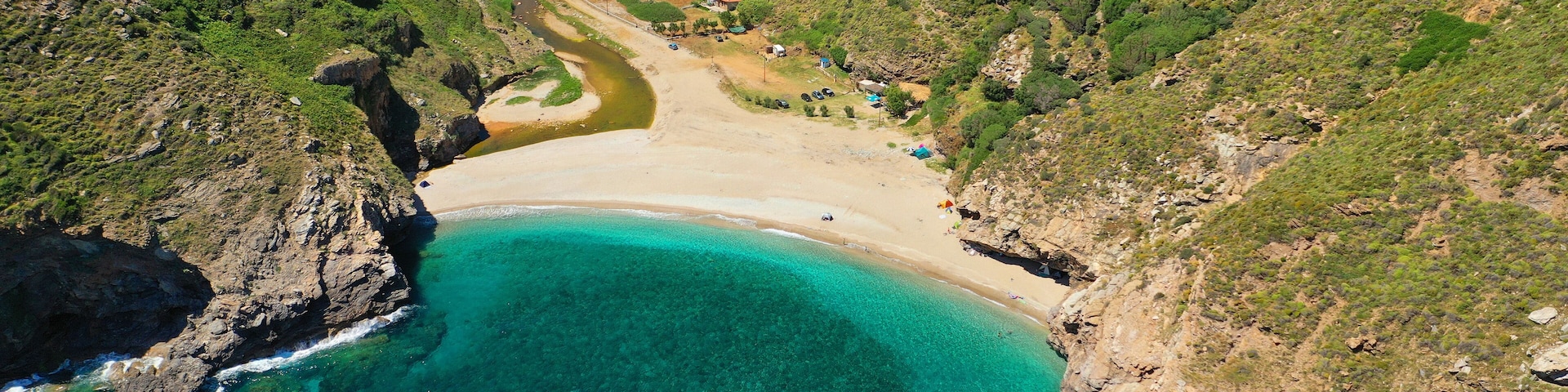 Aerial drone photo of secluded sandy emerald beach and canyon of Agios Dimitrios near Karistos, South Evia island, Greece