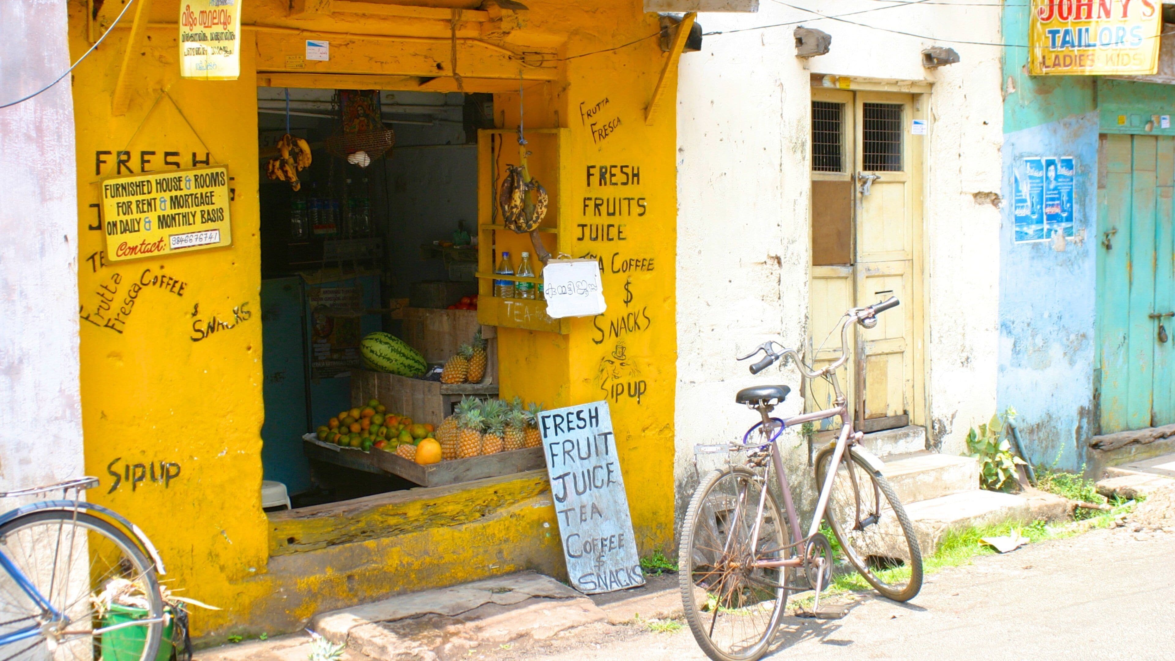 Cochin showing food, a small town or village and street scenes