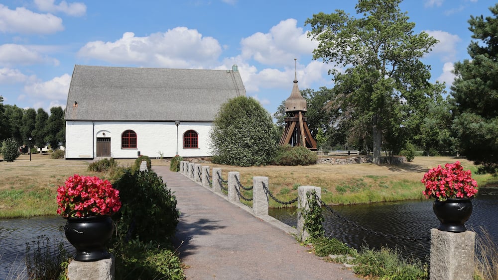 The 18th century church and bell tower of VissefjÀrda, in the Emmaboda Municipality of SmÄland in Sweden.