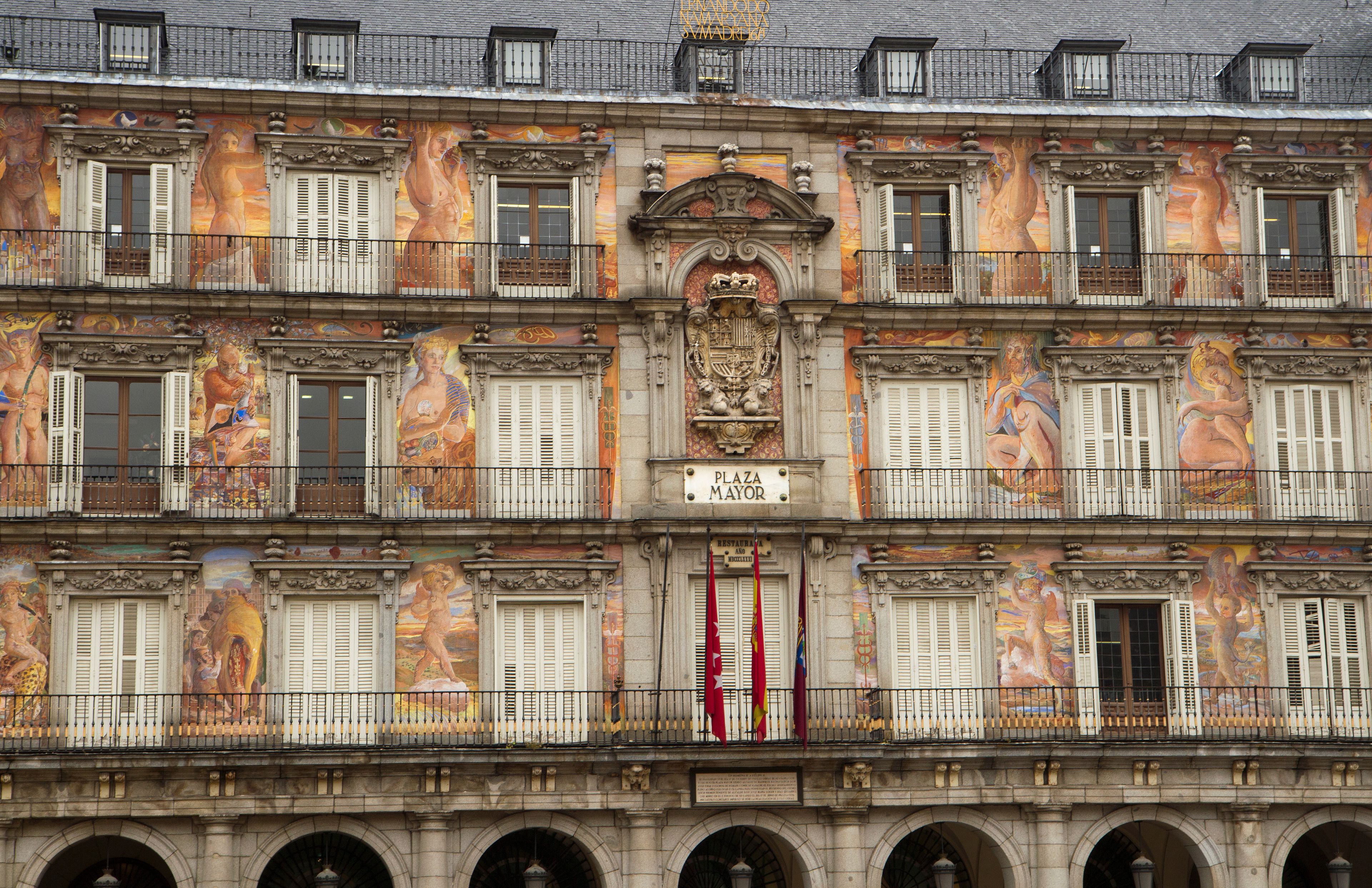 Ancient baroque architecture style. Closeup view of Plaza Mayor de Salamanca facade and exterior design. Its beautiful paintings, windows and balconies. 