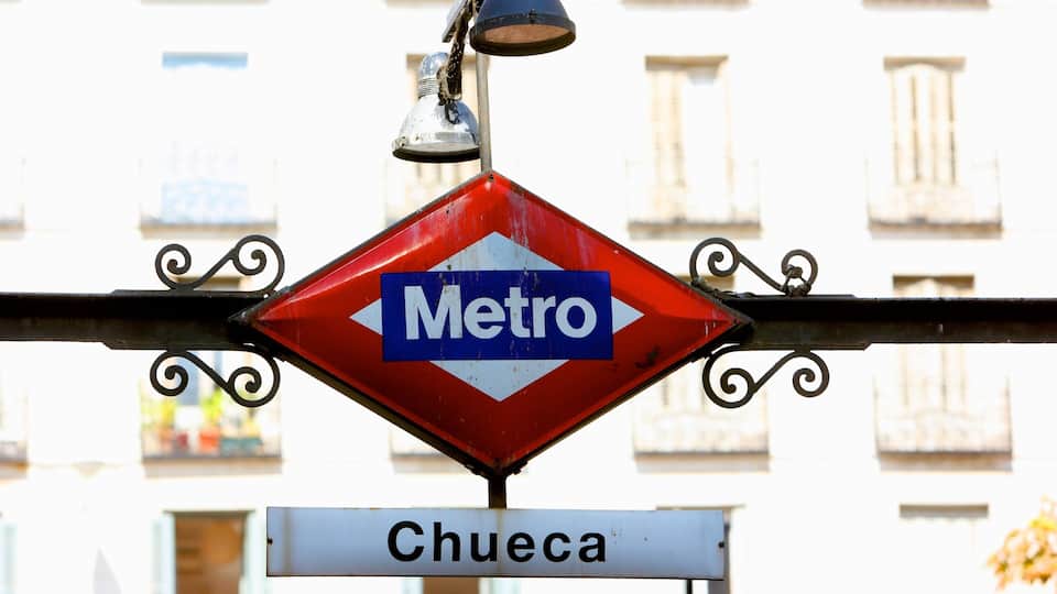 Chueca which includes signage and a city