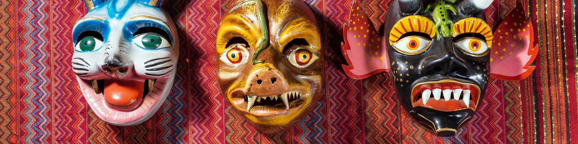 Typical devil Cusco´s masks on a traditional peru fabric