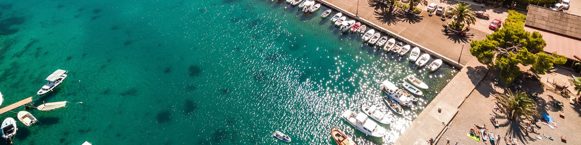 Trpanj Waterfront Aerial View, Peljesac Peninsula, Southern Croatia. Picturesque Coastal Village with Palm Lined Promenade, and Blue Adriatic Waters