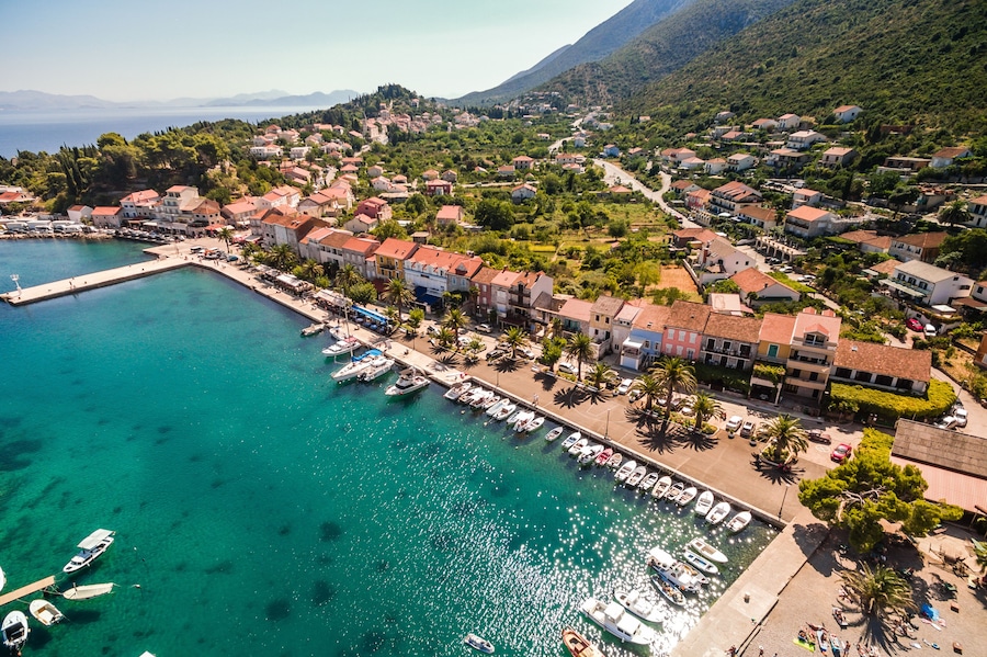 Trpanj Waterfront Aerial View, Peljesac Peninsula, Southern Croatia. Picturesque Coastal Village with Palm Lined Promenade, and Blue Adriatic Waters