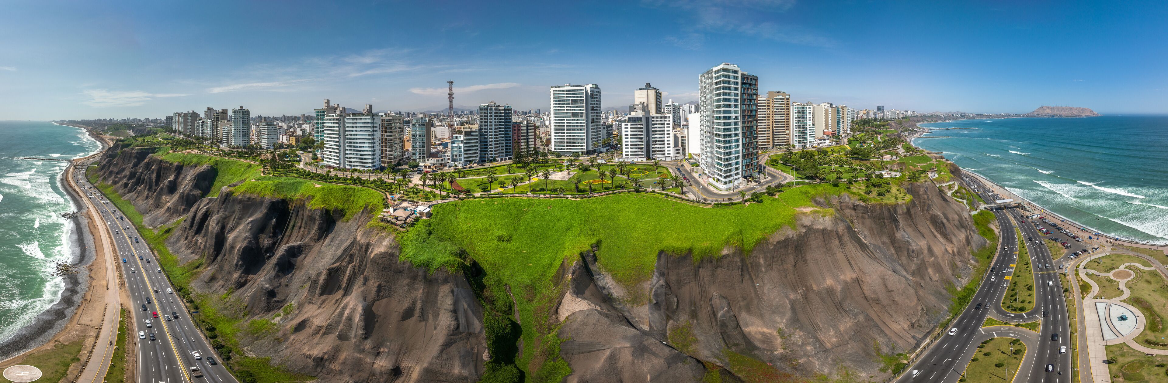 LIMA, PERU: Aerial view of Miraflores town, cliff and the Costa Verde high way