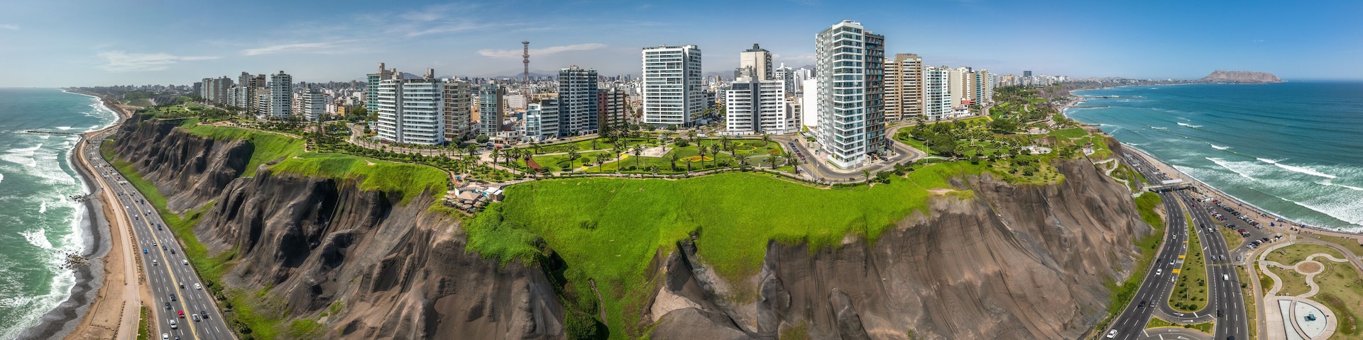 LIMA, PERU: Aerial view of Miraflores town, cliff and the Costa Verde high way