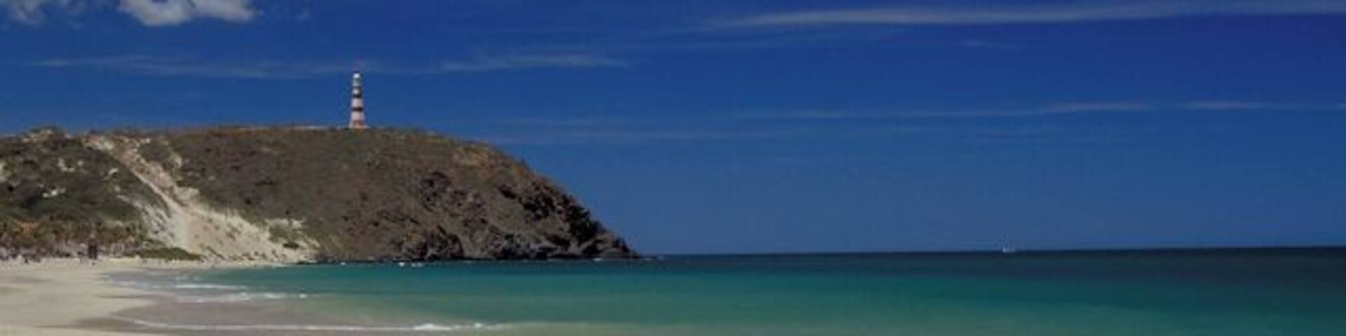 Puerto Cruz beach on the northeast end of the island looking towards the lighthouse on Punta Zaragoza.