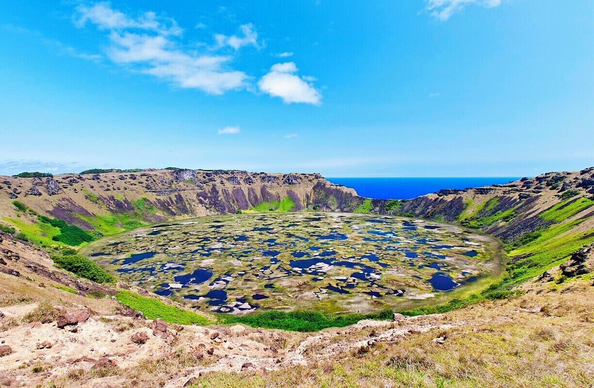 The Rano Kau crater is nearly a mile across and forms the southwestern tip of Easter island. The large crater lake is one of only three bodies of fresh water on the island. The inner slope of the crater was also the site of the last wild toromiro tree, an Easter Island endemic, until it was chopped down for firewood in 1960. Fortunately, Thor Heyerdahl's 1955 expedition collected toromiro seeds, from which trees have been grown and a project is underway to repopulate the island.