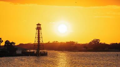 Beautiful sunset over the lake at The Villages in Leesburg, Florida creating a serene evening atmosphere
