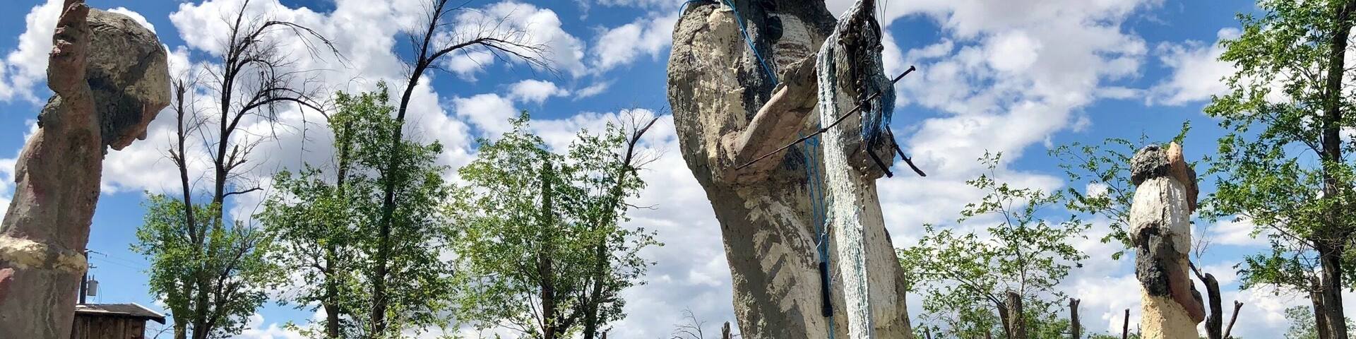 Located about 35 miles west of Winnemucca and visible from I80, the Thunder Mountain Monument was built by Frank Van Zant aka 'Chief Rolling Mountain Thunder' (1921-1989). He moved here in 1968 with his wife and three small children. He started building his unique environment using only discarded items he found within a 50 mile radius of the property. In fact, the only thing he purchased was cement. In 1983 he was named Nevada’s Artist of the Year. Sadly, he committed suicide in 1989. His oldest son now owns the property. The grounds are open to the public.
More info Is available here:
http://www.thundermountainmonument.com/index.htm