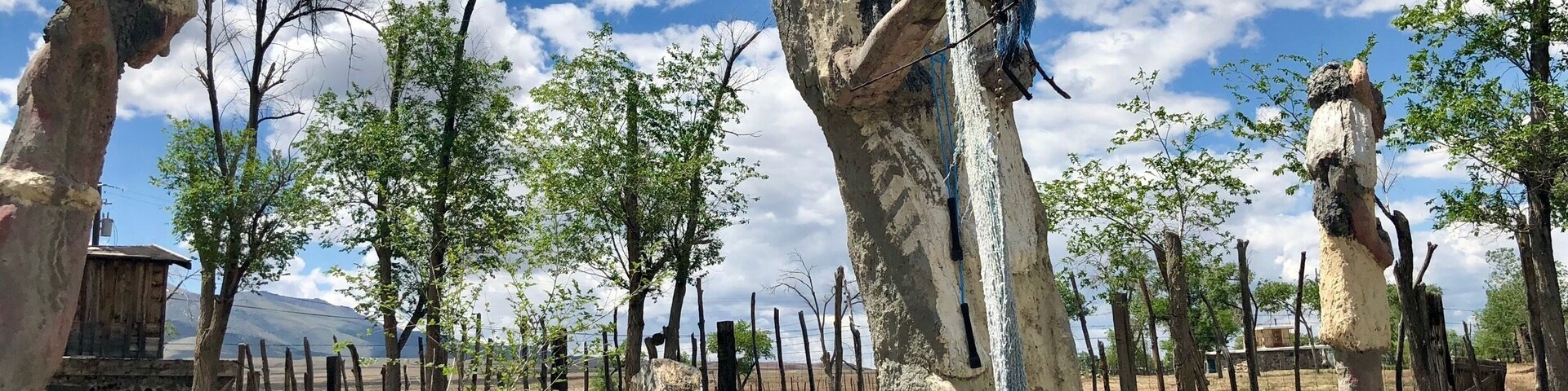 Located about 35 miles west of Winnemucca and visible from I80, the Thunder Mountain Monument was built by Frank Van Zant aka 'Chief Rolling Mountain Thunder' (1921-1989). He moved here in 1968 with his wife and three small children. He started building his unique environment using only discarded items he found within a 50 mile radius of the property. In fact, the only thing he purchased was cement. In 1983 he was named Nevada’s Artist of the Year. Sadly, he committed suicide in 1989. His oldest son now owns the property. The grounds are open to the public.
More info Is available here:
http://www.thundermountainmonument.com/index.htm