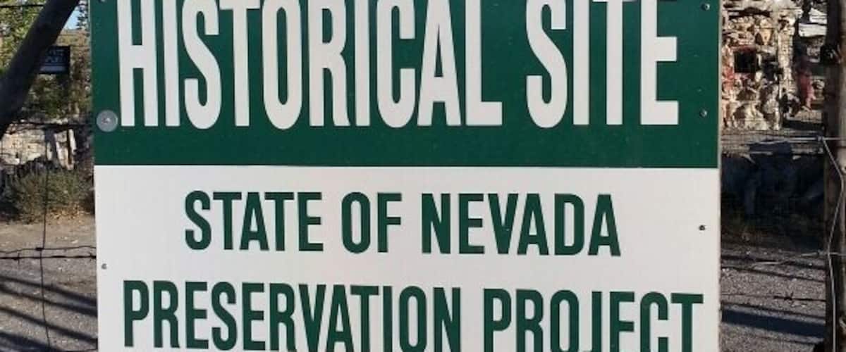 A sign for the Thunder Mountain Indian Monument, a historical site in Nevada, directing visitors to take exit 145.