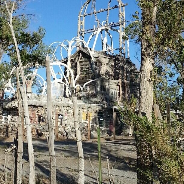 The?Thunder Mountain Monument?is a series ofoutsider art?sculptures and architectural forms which were assembled by Frank Van Zant starting in 1969 upon his arrival in?Imlay, Nevada; it is located on a shoulder of?I-80. A WWII veteran from Oklahoma, Frank Van Zant had served with the?7th Armoured Division,[1]?fighting in several campaigns, and been badly burned in a tank battle outside ofLeipzig, Germany.[2]?A self-identified?Creek Indian,[3]he took the?Native American?name Rolling Mountain Thunder after experiencing an?epiphany, and took on the twin but related tasks of both building shelters from the presumed coming apocalypse, and making a?de facto?spiritual haven for spiritual seekers of the?hippie?era. (There is no Thunder Mountain in the vicinity.)The site contains three stone and cement buildings and over 200 cement sculptures variously depicting Native Americans and their protective spirits, massacres, and purported injustices. Thunder Mountain Monument (or Park) is replete with found objects (such as, but not limited to, car hoods, dolls' heads, typewriters, and gas pumps), many of which are incorporated into the buildings themselves; one framework forms a large handle so the Great Spirit could take the building away after Thunder's death.He was long subjected to harassment by the local townspeople, and his site was partially destroyed by arson in 1983, the same year he was named Nevada's Artist of the Year; a heavy cigarette smoker, Rolling Mountain Thunder committed suicide by shooting himself in the head in 1989. His uniquely wrought environment was neglected and subject to vandalism until it was declared a Nevada State Historic Site in the 1990s; it is now under the care of his grown children under the aegis of a State of Nevada Historic Site Restoration Project, and is partially open to the public for self-guided tours.[4]Frank Van Zant has been the subject of two short documentaries.[5]