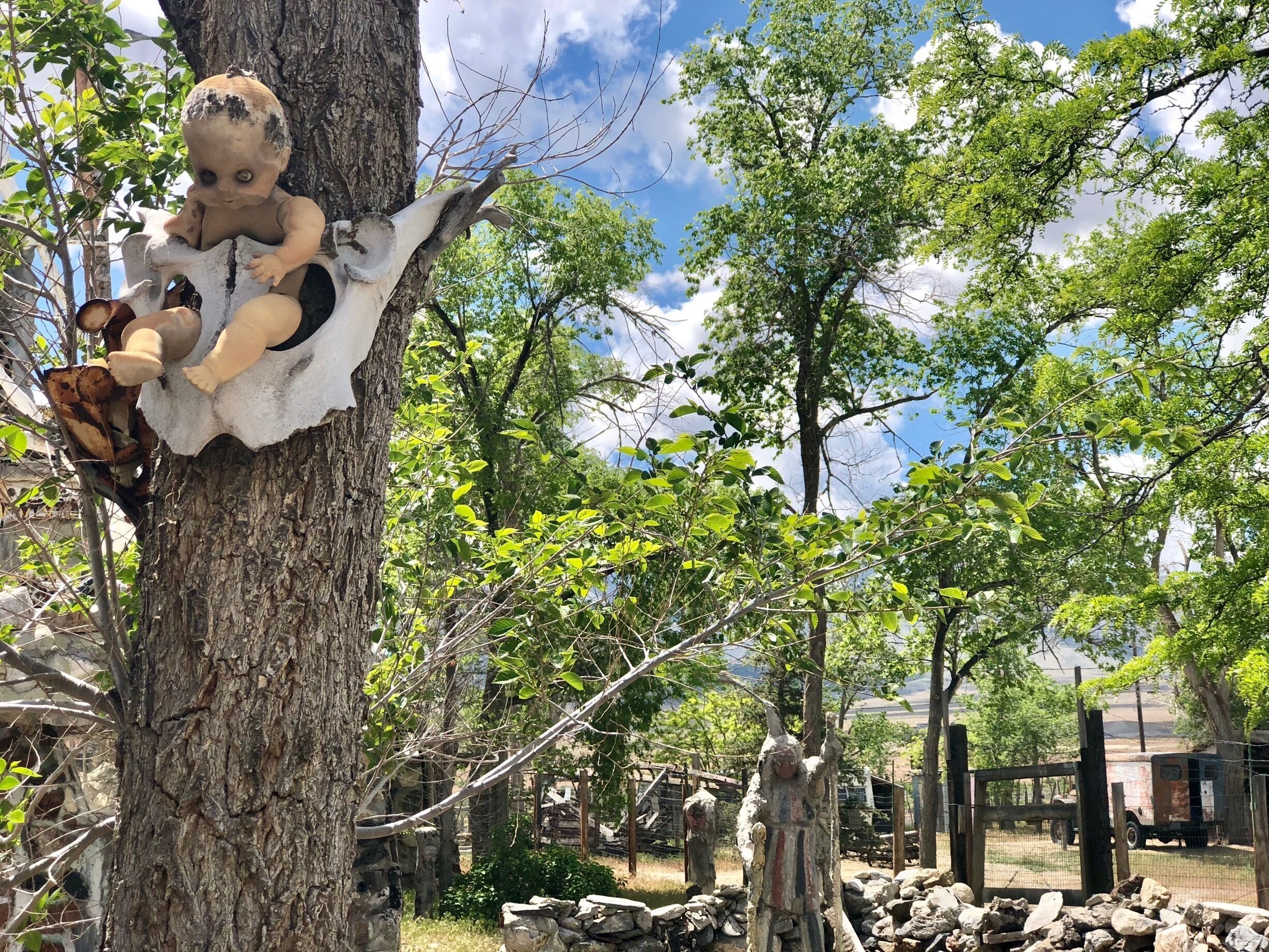 Located about 35 miles west of Winnemucca and visible from I80, the Thunder Mountain Monument was built by Frank Van Zant aka 'Chief Rolling Mountain Thunder' (1921-1989). He moved here in 1968 with his wife and three small children. He started building his unique environment using only discarded items he found within a 50 mile radius of the property. In fact, the only thing he purchased was cement. In 1983 he was named Nevada’s Artist of the Year.  Sadly, he committed suicide in 1989. His oldest son now owns the property. The grounds are open to the public. 

More info Is available here:
http://www.thundermountainmonument.com/index.htm