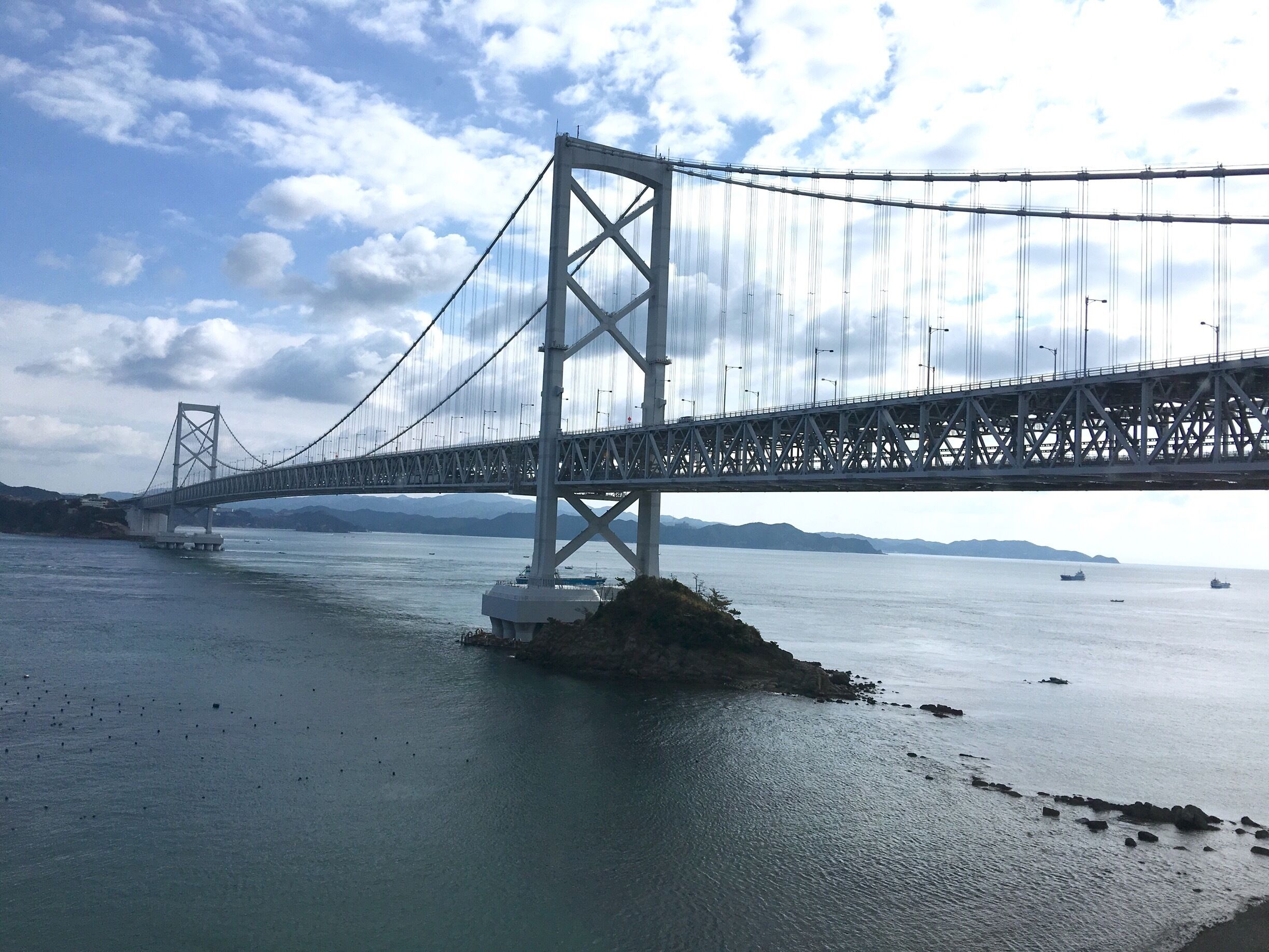 Hot off the press! I just left the Kaigetsu Hotel next to this bridge. Photo taken from hotel lobby. 

The Onaruto Bridge is the most amazing bridge I had been onto. Below the driveway is the walkway for visitors to view the most spectacular natural wonder of Japan I have ever visited! The super natural whirlpool! I walked on it yesterday around low tide to the middle of the sea to view the whirlpools. One underrated natural wonder of the world! MUST SEE if u ever come to Kansai area!!!