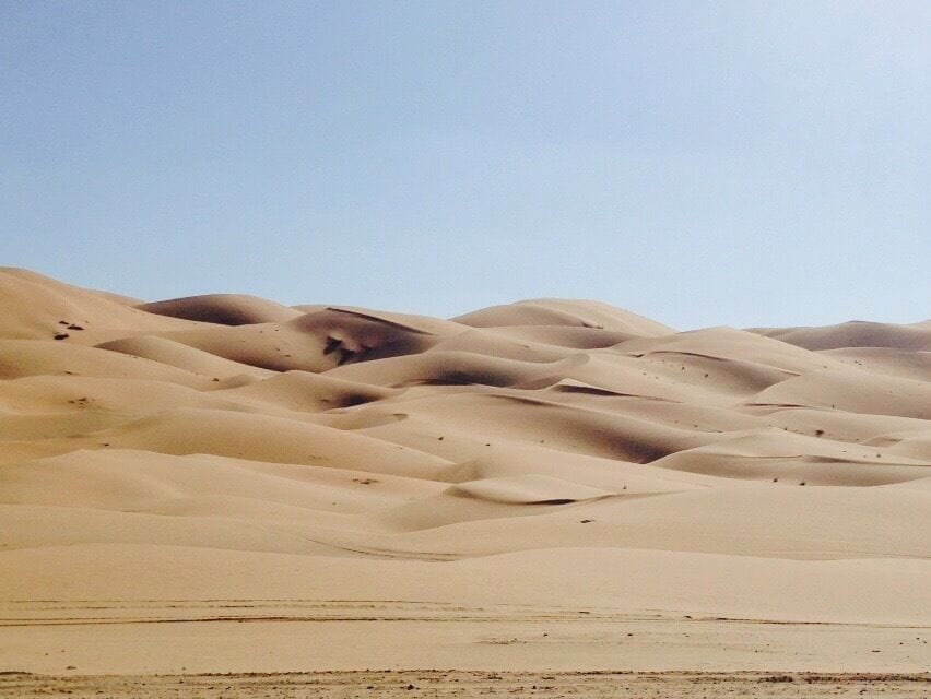 As an expat living in the "empty quarter" of Abu Dhabi, the dunes of Liwa are a familiar sight - a fact made true given that my commute takes me through them weekly. 

The unmarked border between the UAE and Saudi Arabia makes up one of the world's largest sand deserts and is home to some of the tallest sand dunes anywhere. 

Sure, Moreeb Dune is impressive, but the surrounding landscape and feeling of complete isolation is the real reason to take the 2.5 hour drive from Abu Dhabi. Bring water and don't be afraid to get sandy. 