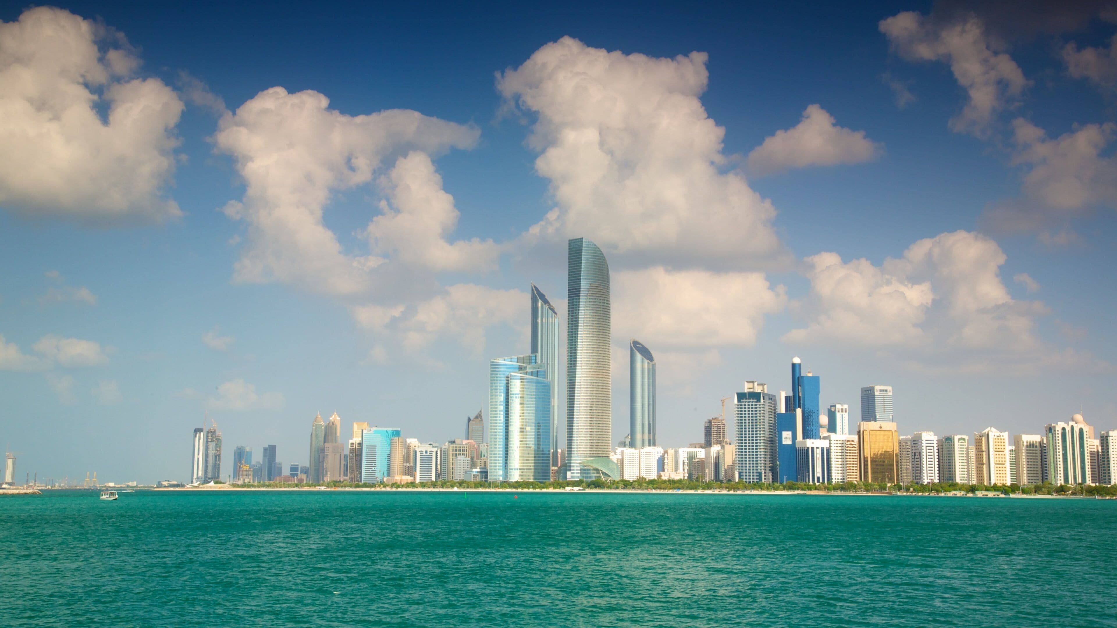 Abu Dhabi fasiliteter samt moderne arkitektur, blokk og silhuett