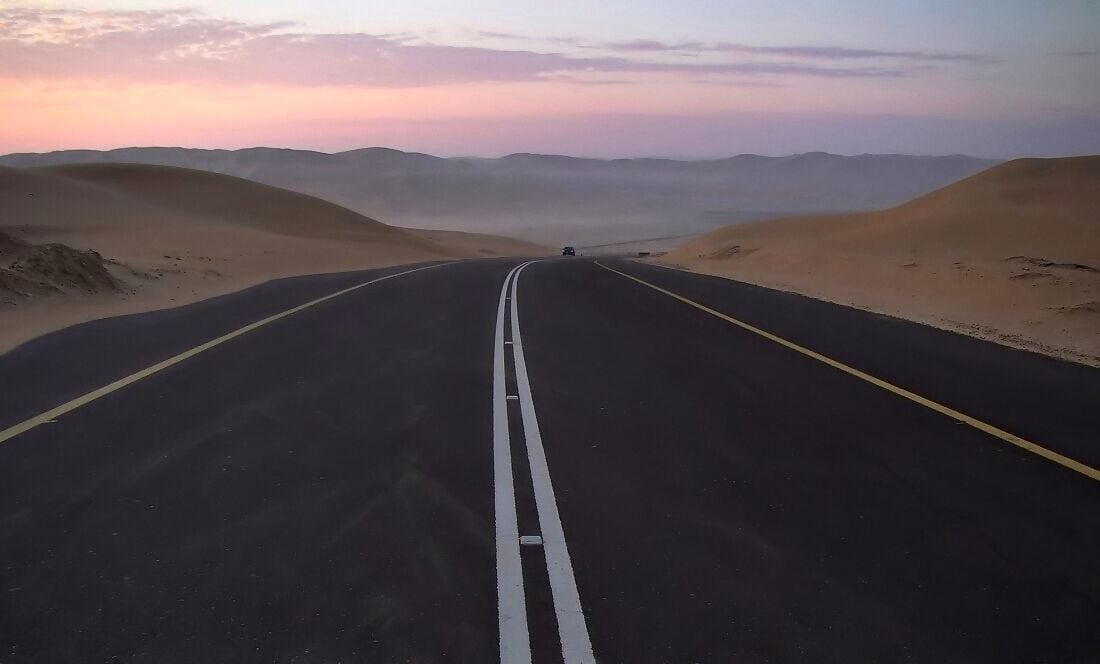 If you're looking for the real desert ,the Empty Quarters near the Liwa Oasis is for you. Photo taken minutes before sunrise of a lone vehicule travelling the excellent road leading to the highest dune in the area ( at the actual end of that road ) the 287m-high Moreeb Dune .The drive up there passes through the most sublime of sand dunes that are in my opinion best viewed around sunrise and sunset