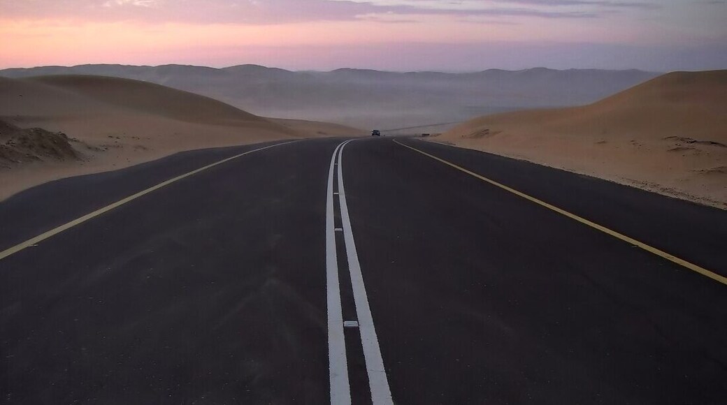 If you're looking for the real desert ,the Empty Quarters near the Liwa Oasis is for you. Photo taken minutes before sunrise of a lone vehicule travelling the excellent road leading to the highest dune in the area ( at the actual end of that road ) the 287m-high Moreeb Dune .The drive up there passes through the most sublime of sand dunes that are in my opinion best viewed around sunrise and sunset
