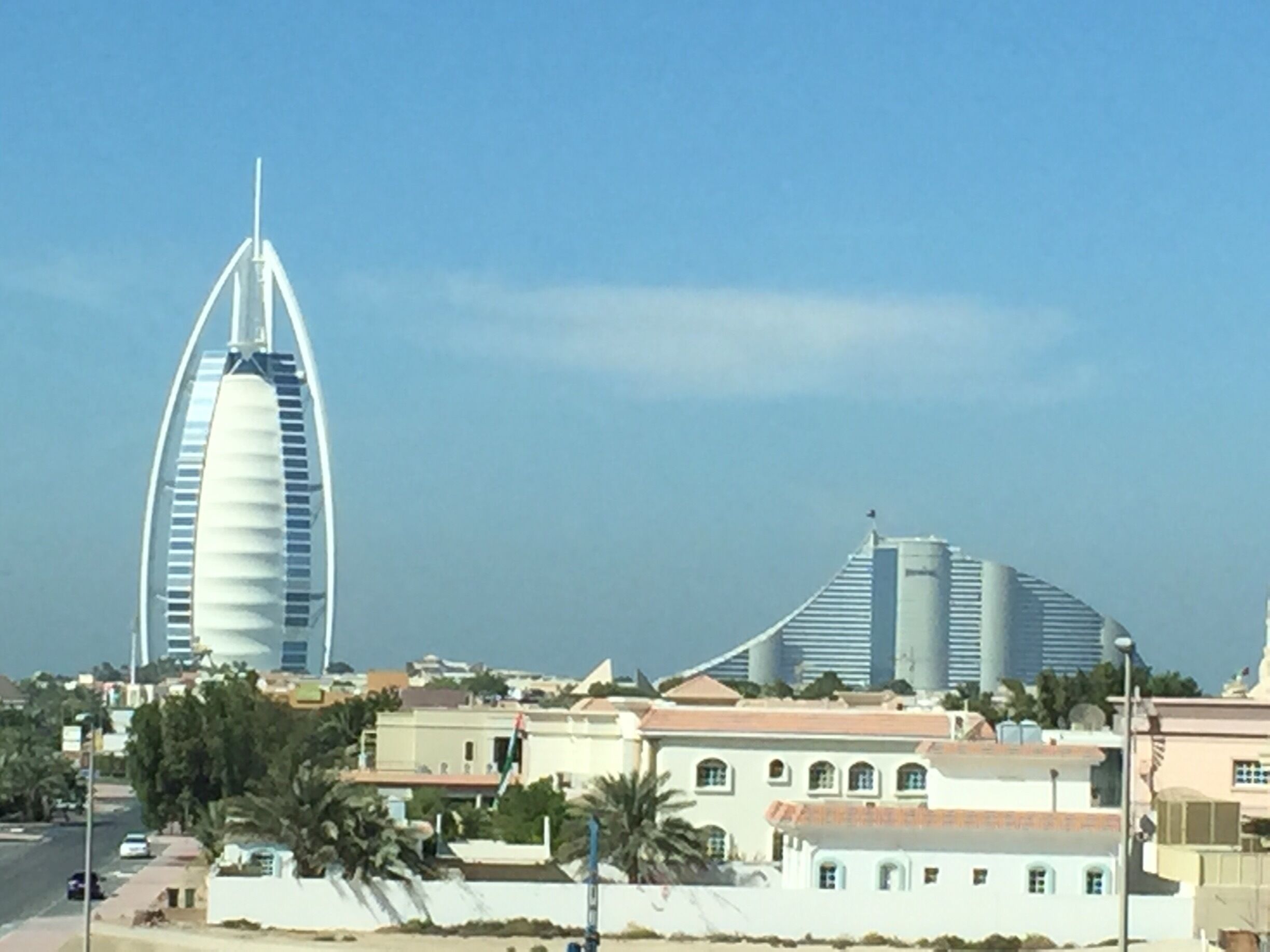 The only 7-star luxury hotel in the world as well as the tallest hotel in the world. This pic was taken from the moving metro without going all the way to the compound. I came for it but wasn't inspired when I found out that one has to pay to get in (no exception, not even to the reception!). One can only get in if one is paying over US$100 min (high tea) to at least US$200 for a meal per person! That's downright robbery! Not to mention a room a night would set u back by over US$600 at the least! Yes, it is exclusive in that sense but I reckon I have better use of my money!

I did see a documentary around 15 years ago on the establishment so I have a clear idea of what's inside. So, if chosen to go in be aware it is already 15 year old this year!

I suppose one can take a cab to the nearby public beaches to take a photo of it or to the souk nearby. I visited the souk but again it is a man made tourist place which is not too interesting!

#dubai #architecture #hotel