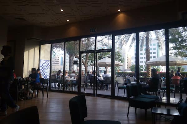 Spacious but crowded Starbucks coffee shop at Al Ghurair Centre