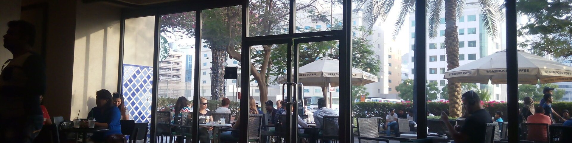 Spacious but crowded Starbucks coffee shop at Al Ghurair Centre