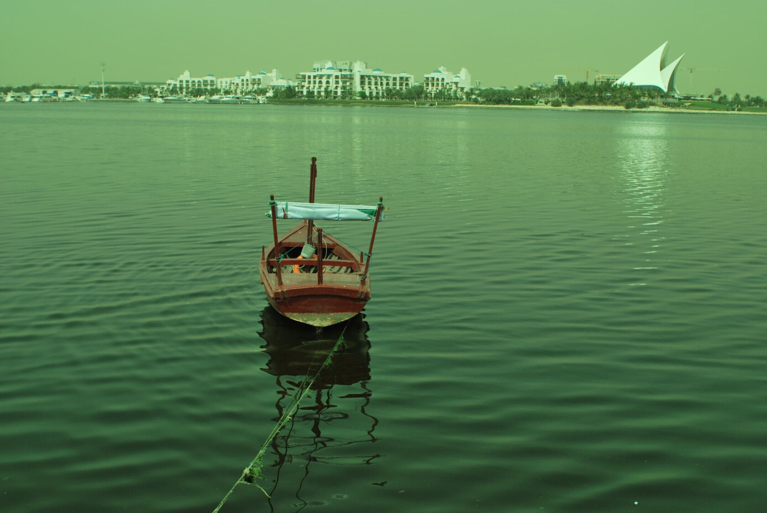 Lone boat overlooking the Hilton Hyatt Park Hotel