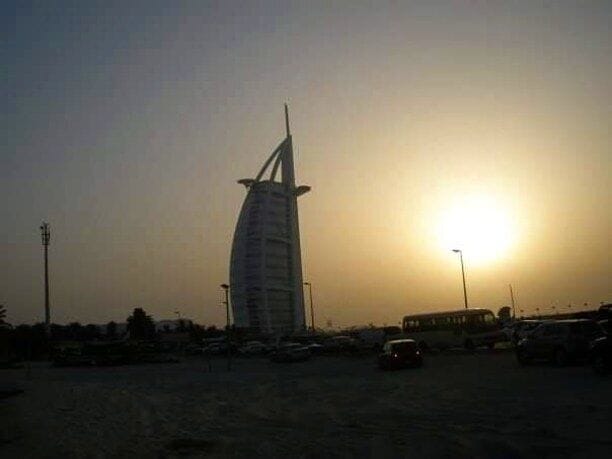 Sunset at Jumeirah Beach overlooking the most luxurious hotel in the world, Burj Al-Arab