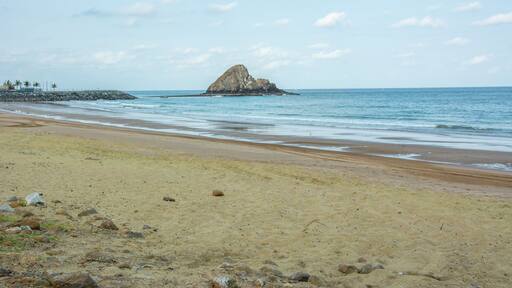 Al Aqah beach and the Snoopy island on the Gulf of Oman (part of the Indian Ocean) near the city of Fujairah, the capital of the emirate of Fujairah in the United Arab Emirates