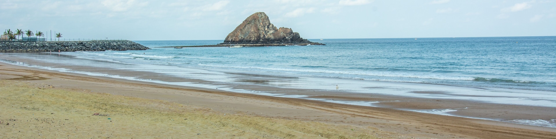 Al Aqah beach and the Snoopy island on the Gulf of Oman (part of the Indian Ocean) near the city of Fujairah, the capital of the emirate of Fujairah in the United Arab Emirates