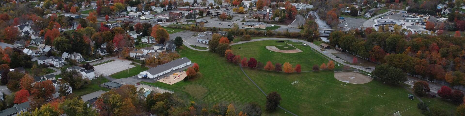 Photo of a sunset through the trees at Mill Pond, Pittsfield, Maine, the USA