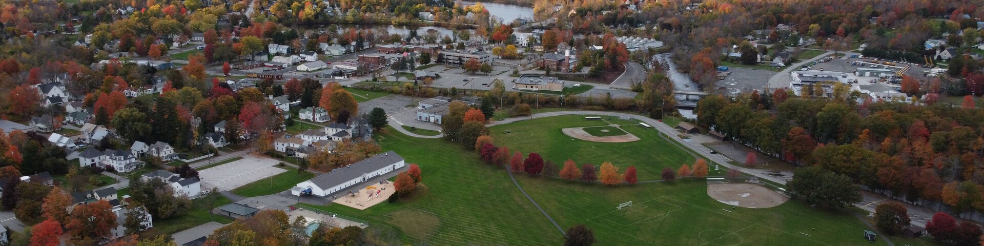 Photo of a sunset through the trees at Mill Pond, Pittsfield, Maine, the USA