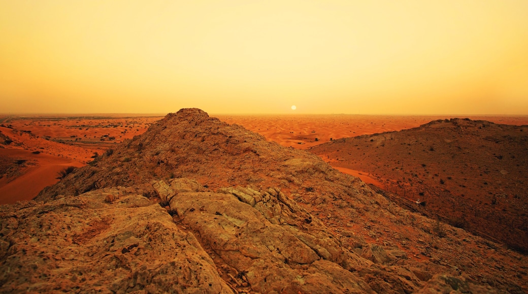 Al awir desert and mountains, Dubai, UAE in sunset warm light