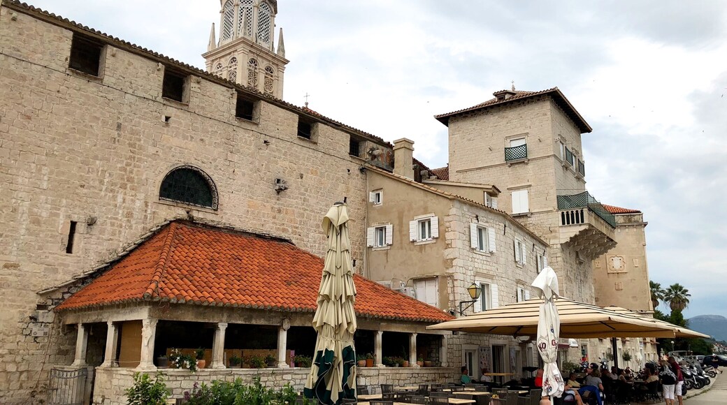 Trogir is a town on the central Adriatic coast of Croatia. Its preserved old town, known for its mix of Renaissance, baroque and Romanesque buildings, lies on a small island connected to the mainland and the island of Čiovo by bridges. The 13th-century Cathedral of St. Lawrence houses the Renaissance Chapel of St. John and offers sweeping views from its bell tower. Parts of the medieval city walls remain intact.