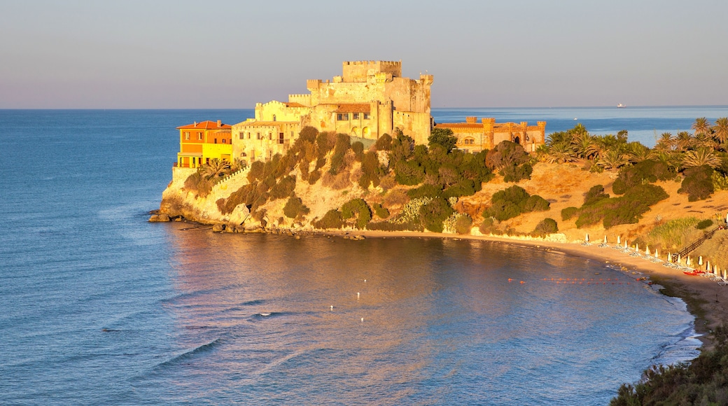 Sunrise on turquoise sea frames the medieval Falconara Castle, Butera, Province of Caltanissetta, Sicily, Mediterranean